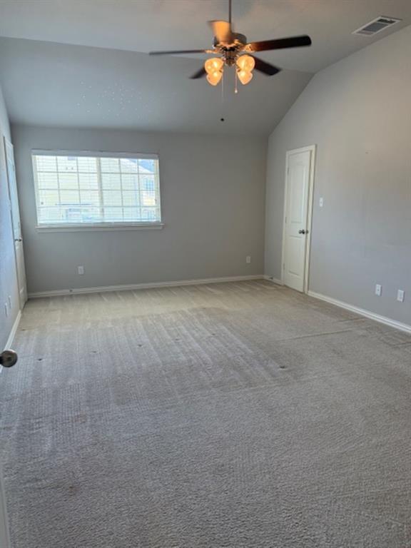 4119 Nia Drive Irving, TX 75038 - Photo 9 of 15 Unfurnished room with vaulted ceiling, carpet floors, and a ceiling fan