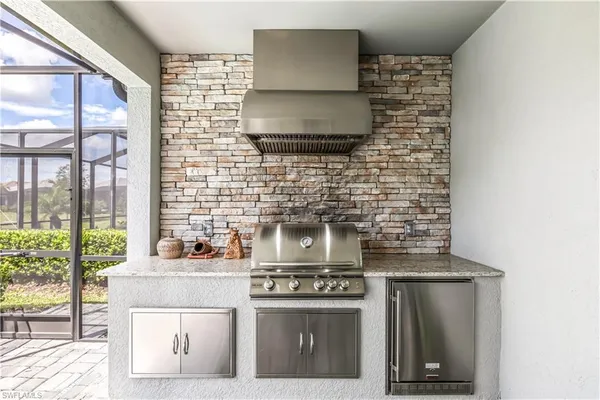 a kitchen with a stove and a microwave