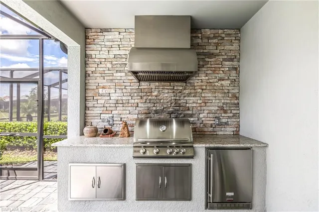 a kitchen with a stove and a microwave
