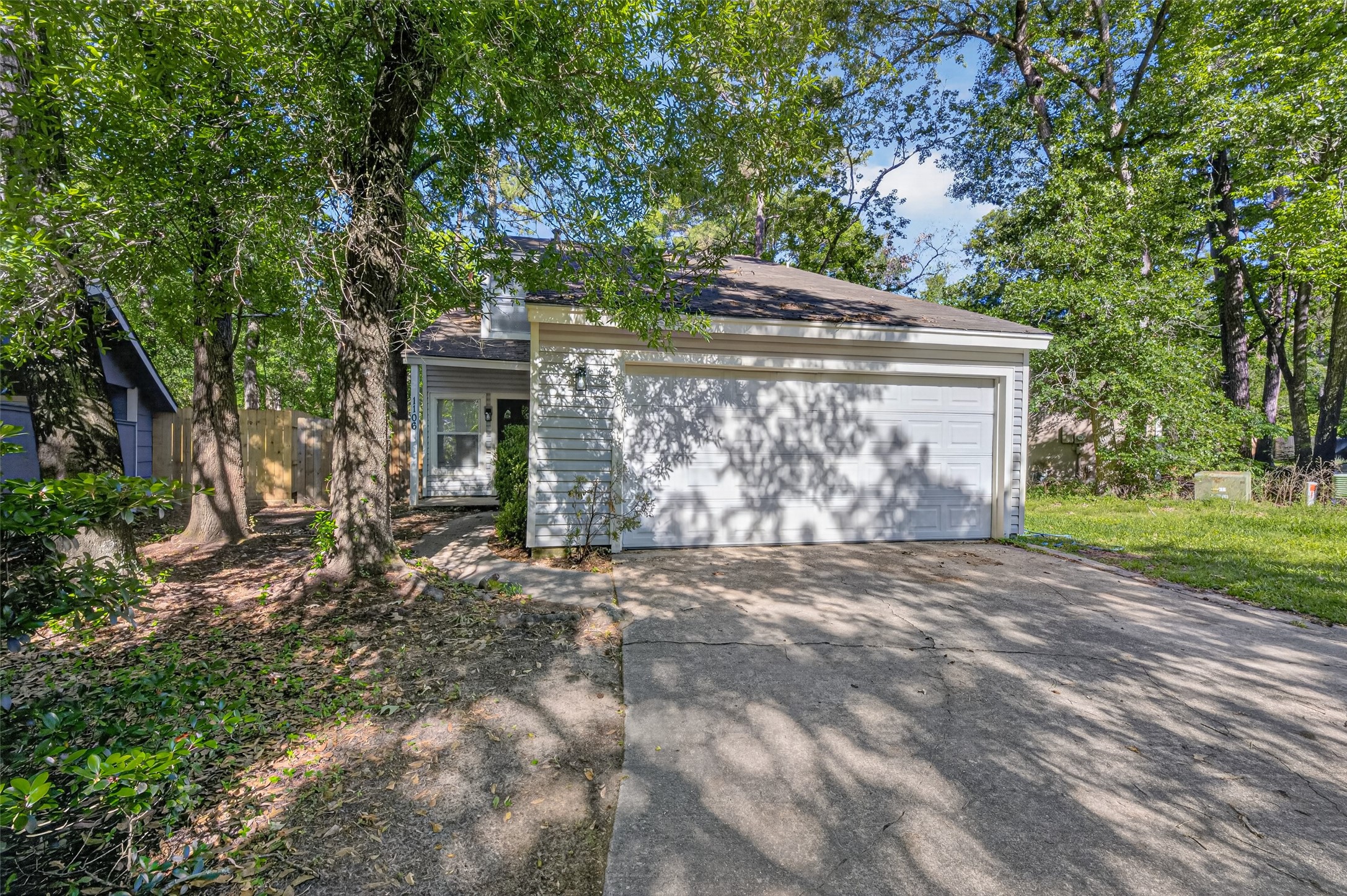 1106 East Red Cedar Circle Spring, TX 77380 - Photo 2 of 43 a front view of a house with garden