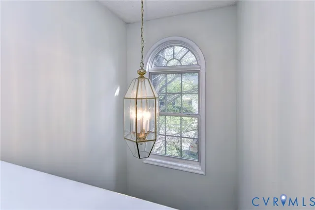 an empty room with windows and mountain view