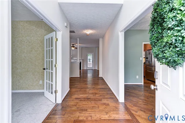 a view of a hallway with the wooden floor