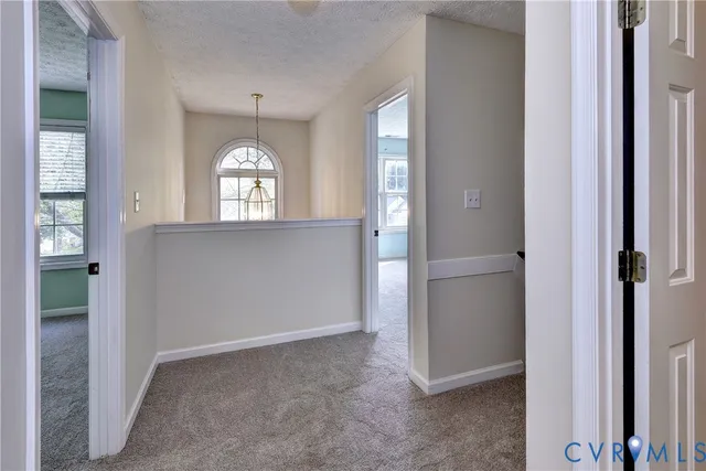 an empty room that has a window in it