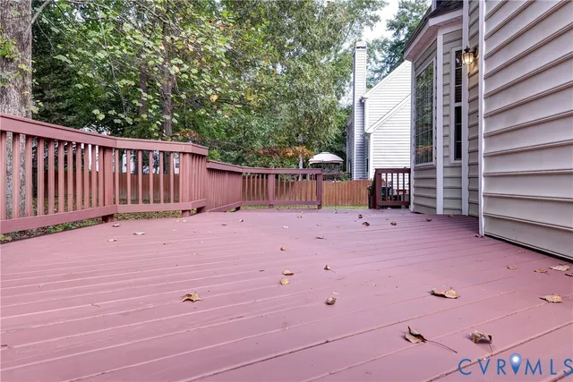 a view of a deck with a backyard