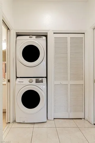 a view of a storage & utility room with dryer and washer