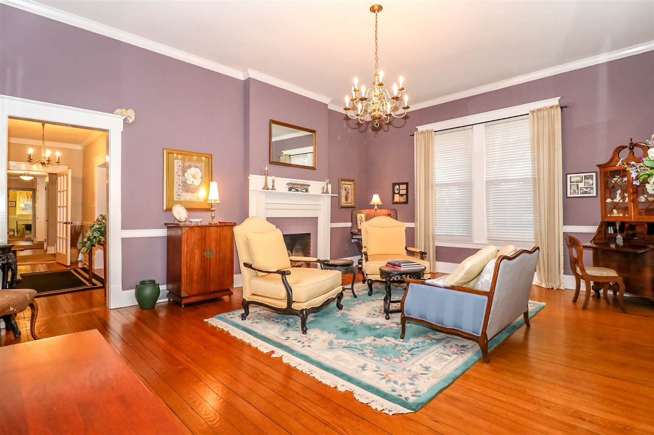 7745 Rock Quarry Road Raleigh, NC 27610 - Photo 3 of 25 An elegant space with original hardwood flooring and 10ft ceilings. Fireplace is capped and only for decorative purposes in this room. Living Room
