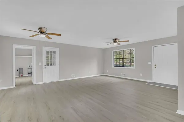 a view of an empty room with a window