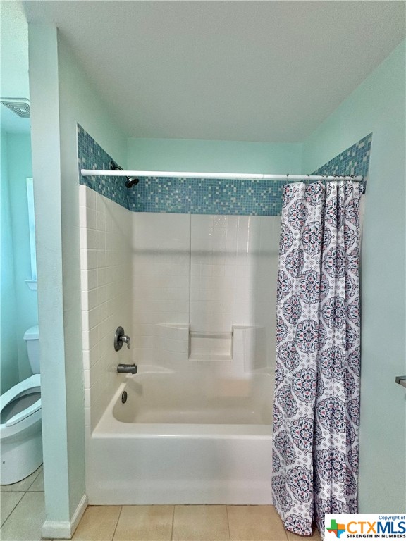 512 West Adams Street Port O'Connor, TX 77982 - Photo 13 of 27 a bathroom with a bathtub a shower and a tub