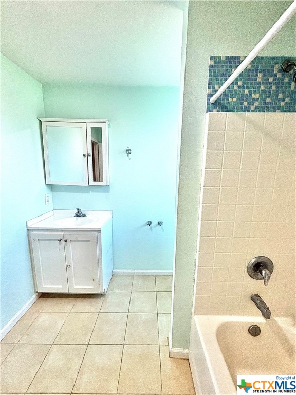 512 West Adams Street Port O'Connor, TX 77982 - Photo 15 of 27 a bathroom with a sink a vanity and mirror