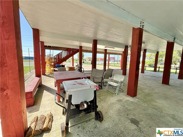 a view of a livingroom with furniture and window