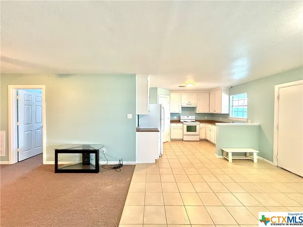 a living room with furniture and a table