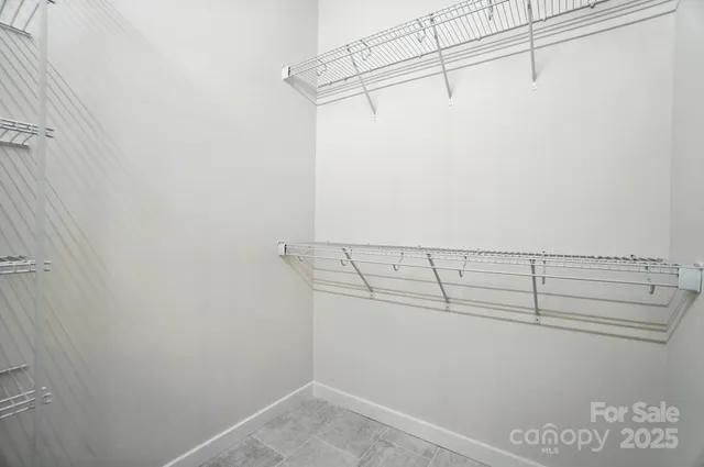 a bathroom with a shower and a sink