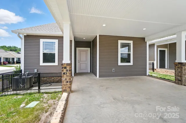 a view of an house with backyard porch and furniture