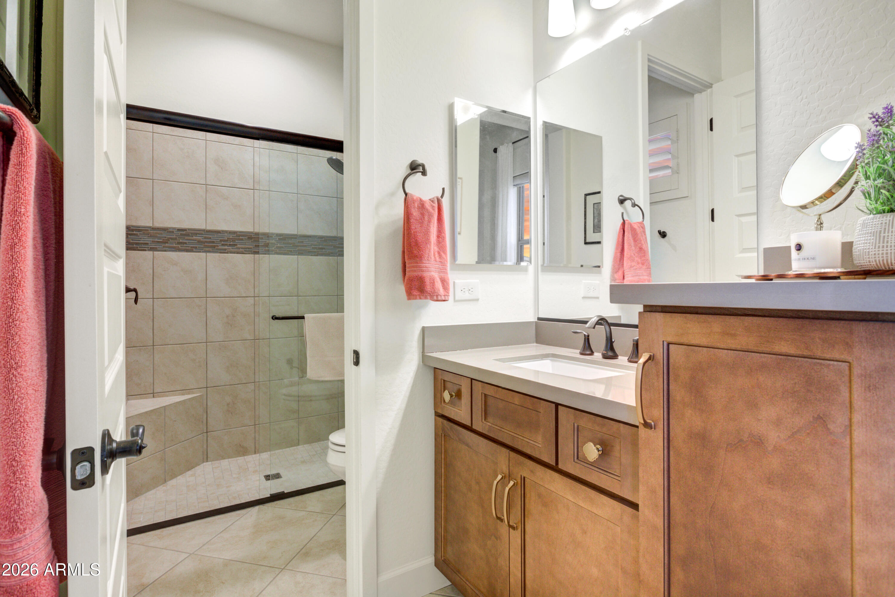 28517 North Camel Rock Court Rio Verde, AZ 85263 - Photo 23 of 39 a bathroom with a sink vanity granite shower and a mirror