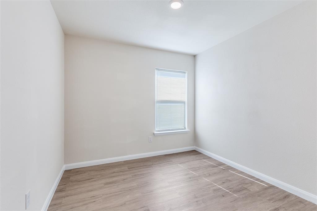 144 Barbwire Way Newark, TX 76071 - Photo 17 of 24 wooden floor in an empty room