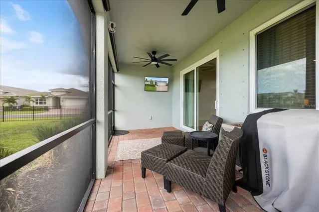 a balcony with furniture and a garden