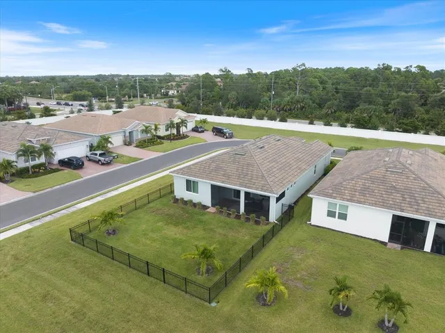 a view of a big house with a mountain in the background