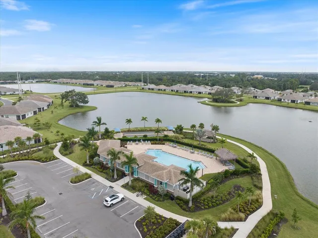 an aerial view of a house with a lake view