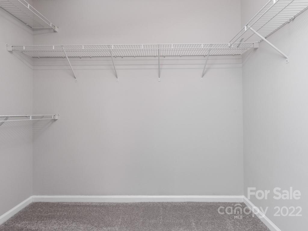 8215 Fox Swamp Road Charlotte, NC 28215 - Photo 14 of 25 a view of a room with racks on the wall