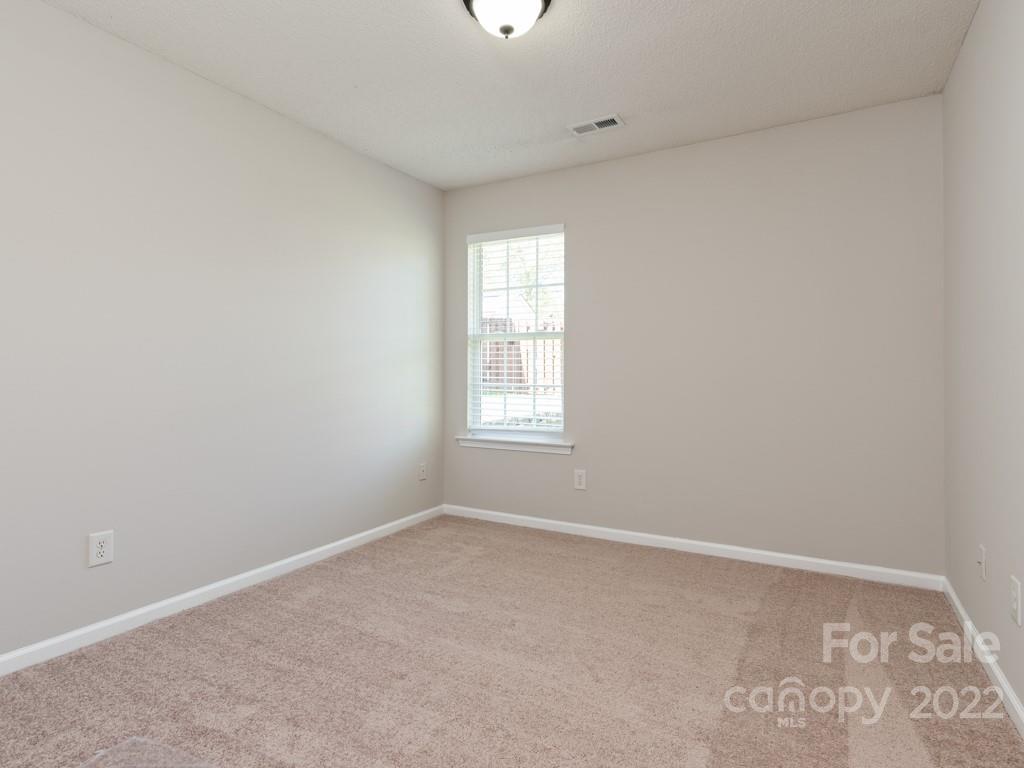 8215 Fox Swamp Road Charlotte, NC 28215 - Photo 15 of 25 an empty room with a window