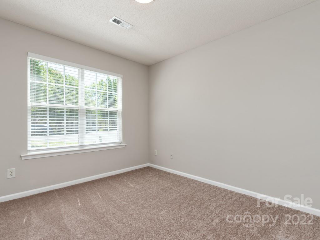 8215 Fox Swamp Road Charlotte, NC 28215 - Photo 17 of 25 an empty room with a window