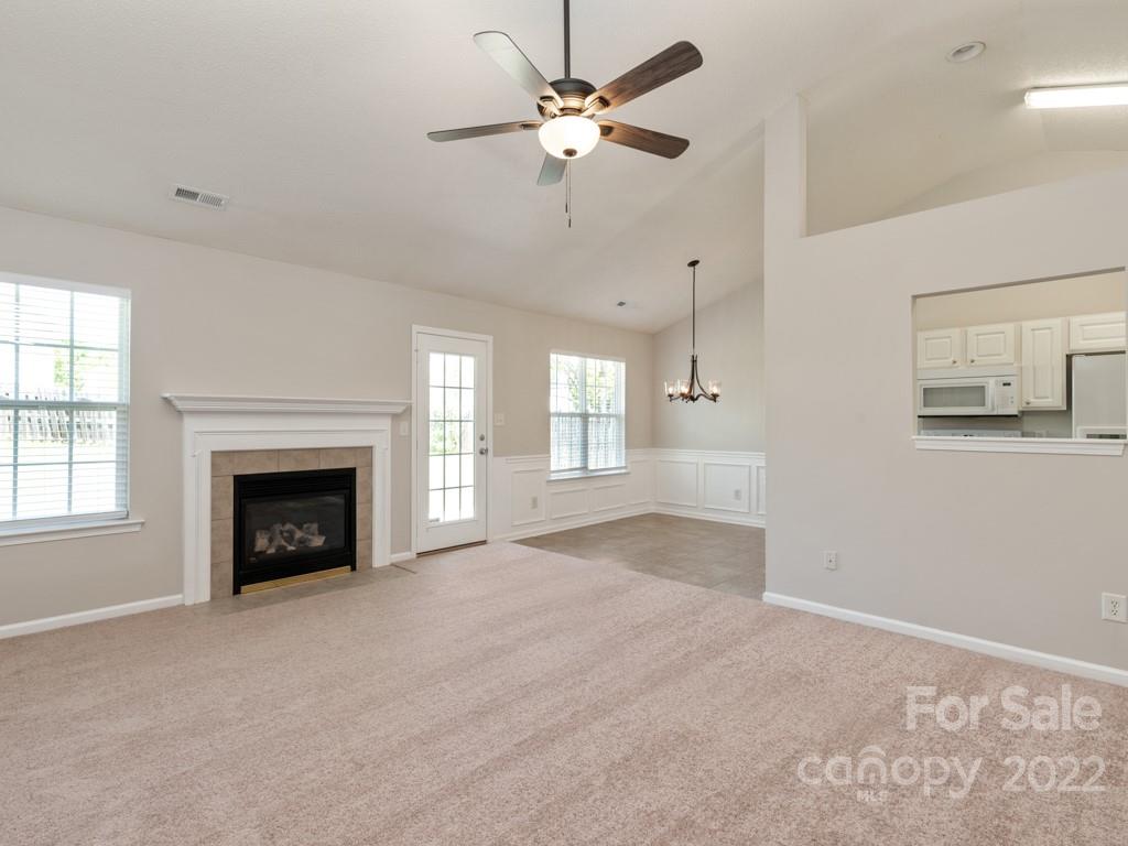8215 Fox Swamp Road Charlotte, NC 28215 - Photo 4 of 25 a view of an empty room with a fireplace
