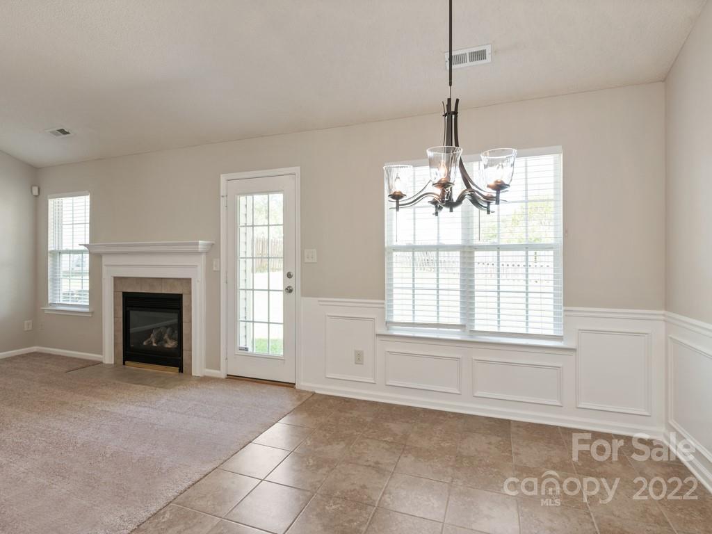 8215 Fox Swamp Road Charlotte, NC 28215 - Photo 8 of 25 a view of an empty room with window and fireplace
