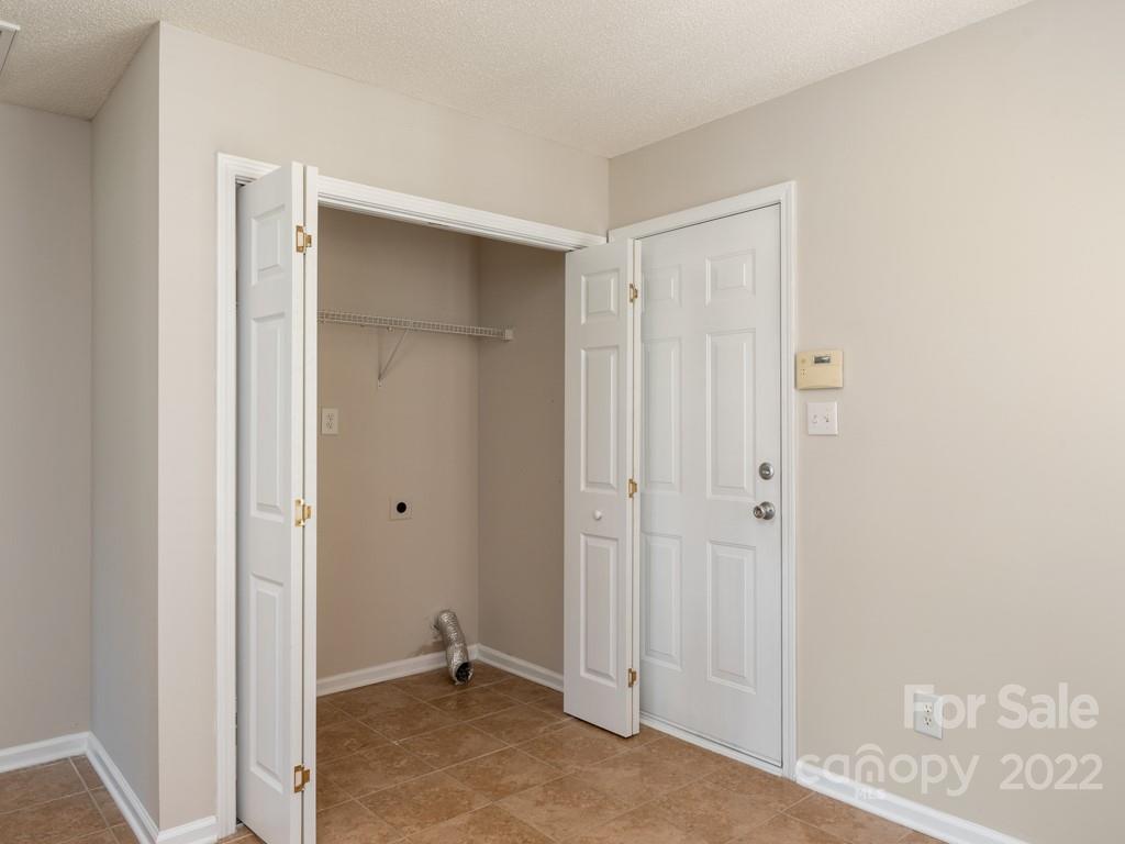 8215 Fox Swamp Road Charlotte, NC 28215 - Photo 9 of 25 a view of room with walk in closet