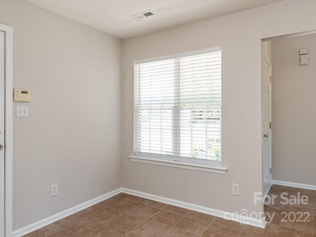 8215 Fox Swamp Road Charlotte, NC 28215 - Photo 10 of 25 a view of an empty room with a window