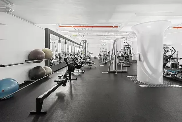 front view of a building with a garden