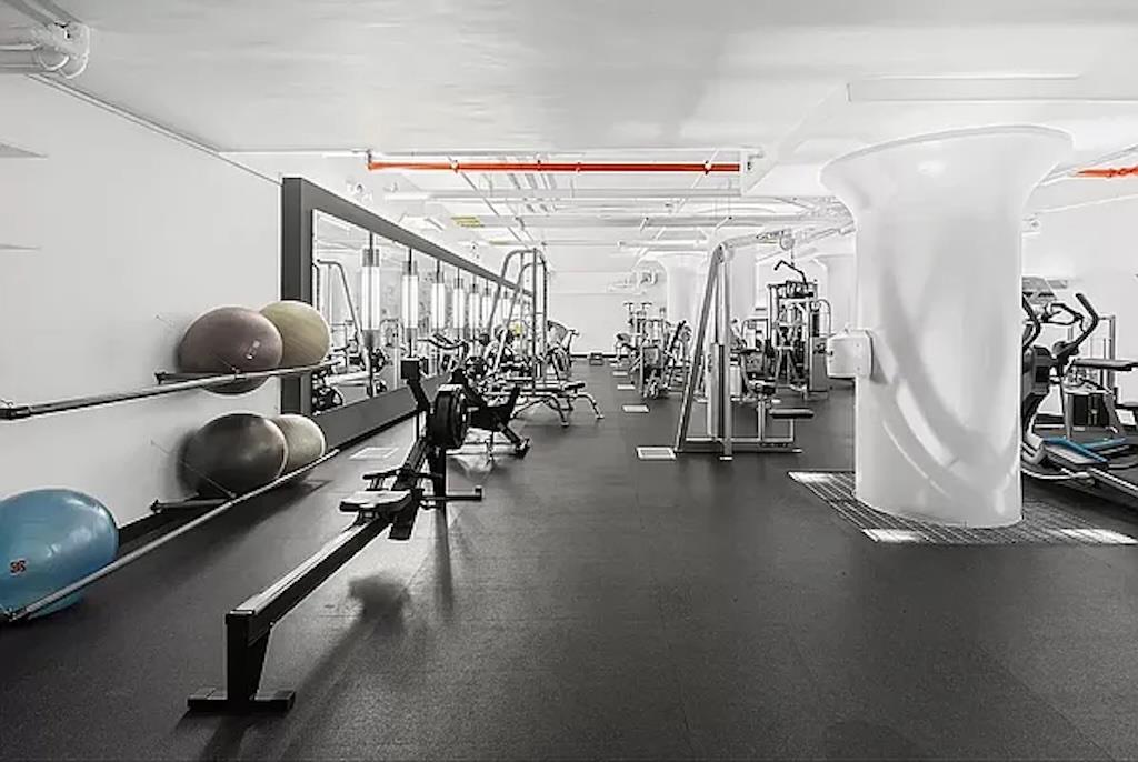 27-28 Thomson Avenue, Unit 804 Queens, NY 11101 - Photo 14 of 17 a view of a room with gym equipment