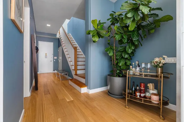 a white toilet sitting next to a bathroom sink and shower