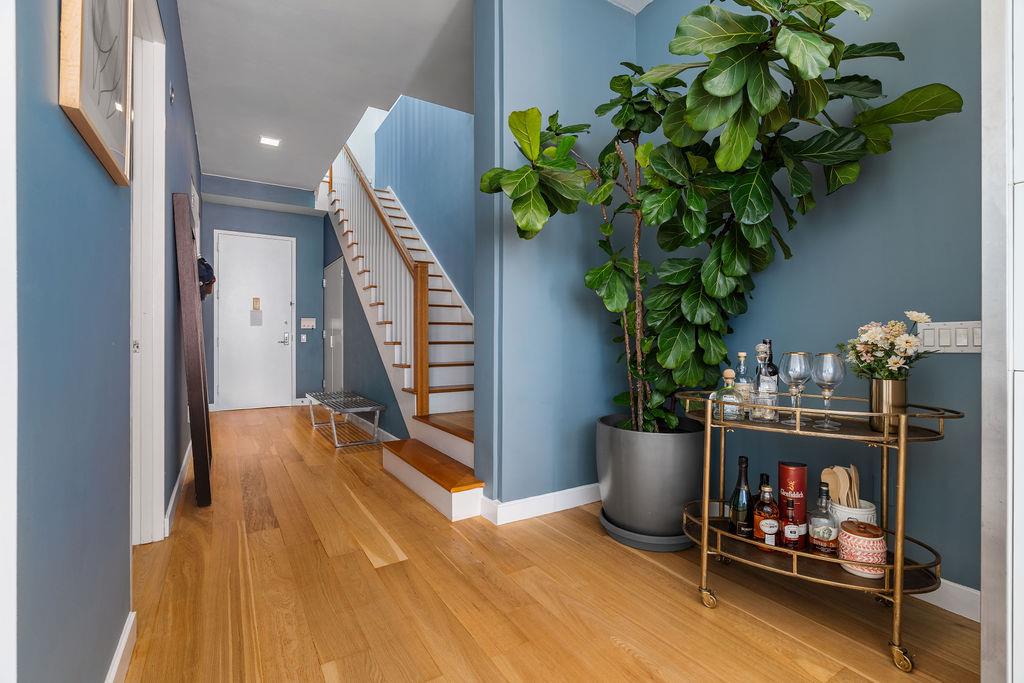 27-28 Thomson Avenue, Unit 804 Queens, NY 11101 - Photo 9 of 17 a living room with furniture and flowers