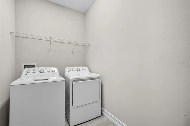 a utility room with dryer and washer