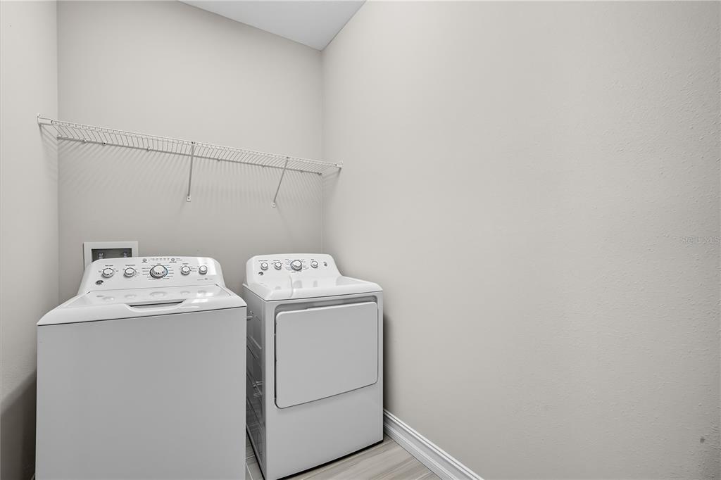 4663 Almada Lane Wesley Chapel, FL 33543 - Photo 14 of 30 a utility room with dryer and washer