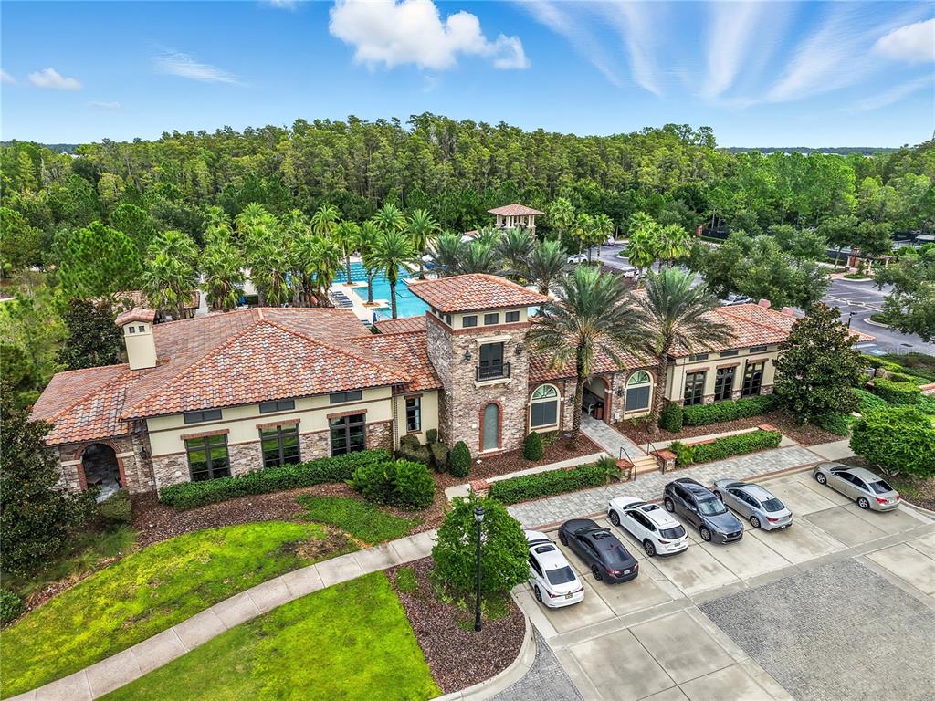 4663 Almada Lane Wesley Chapel, FL 33543 - Photo 22 of 30 a front view of a house with garden
