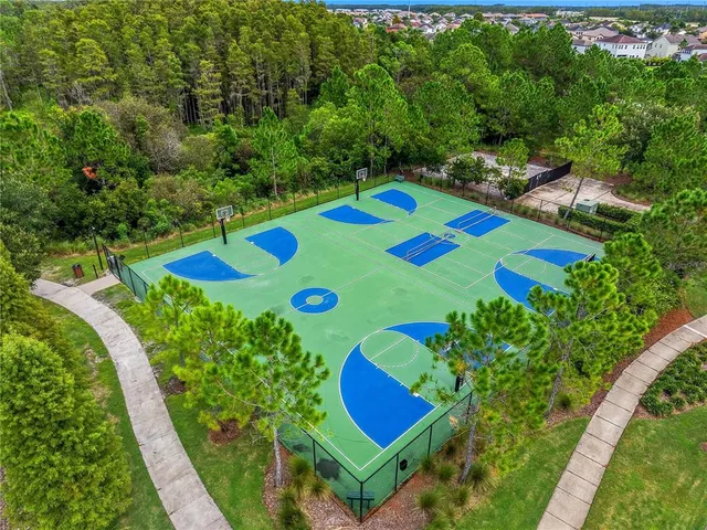 an aerial view of residential houses with outdoor space