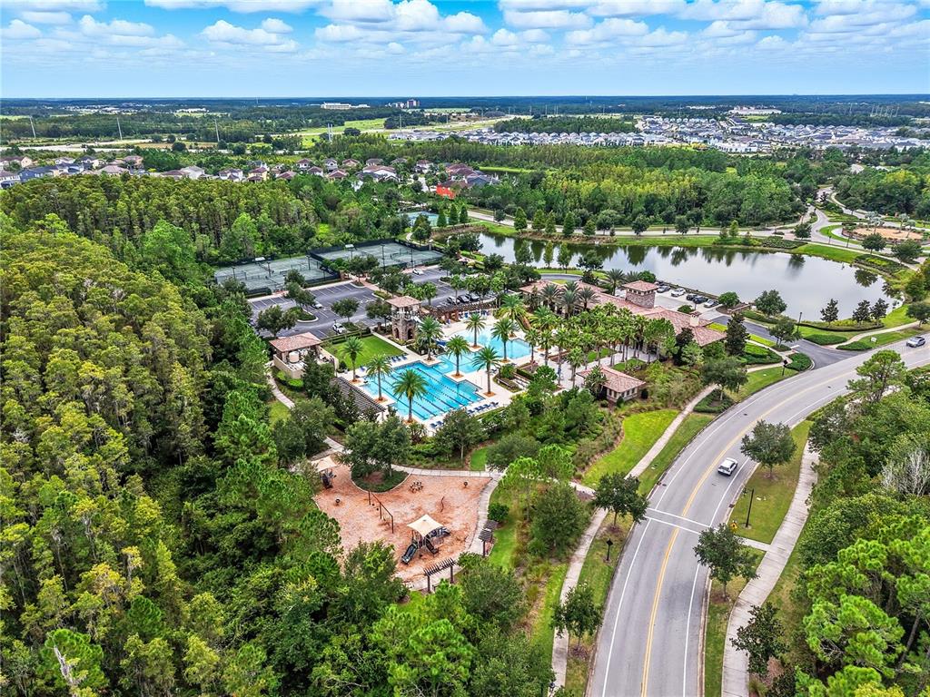 4663 Almada Lane Wesley Chapel, FL 33543 - Photo 26 of 30 an aerial view of residential houses with outdoor space