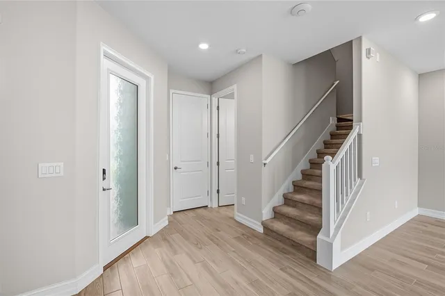 a view of entryway with wooden floor