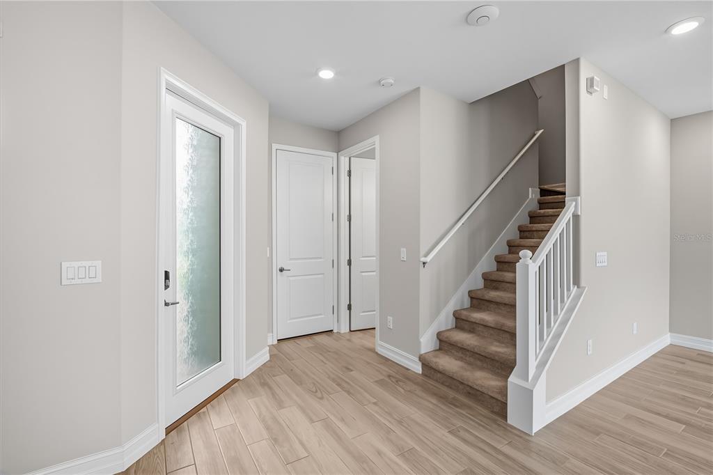 4663 Almada Lane Wesley Chapel, FL 33543 - Photo 5 of 30 a view of entryway with wooden floor