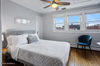 a bedroom with a bed a desk and chair