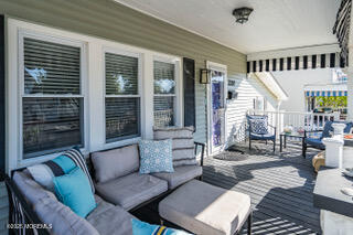 220 13th Avenue Belmar, NJ 07719 - Photo 2 of 21 a living room with furniture and a large window