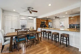 a view of a dining area with furniture and chandelier