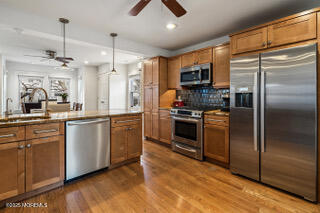 220 13th Avenue Belmar, NJ 07719 - Photo 10 of 21 a kitchen with stainless steel appliances granite countertop a refrigerator a stove a sink and a refrigerator