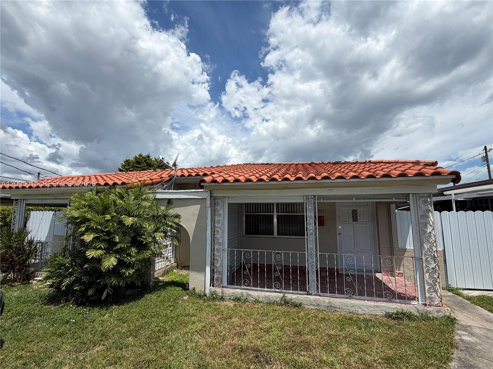3361 Southwest 28th Street Miami, FL 33133 - Photo 1 of 17 a front view of a house with a garden