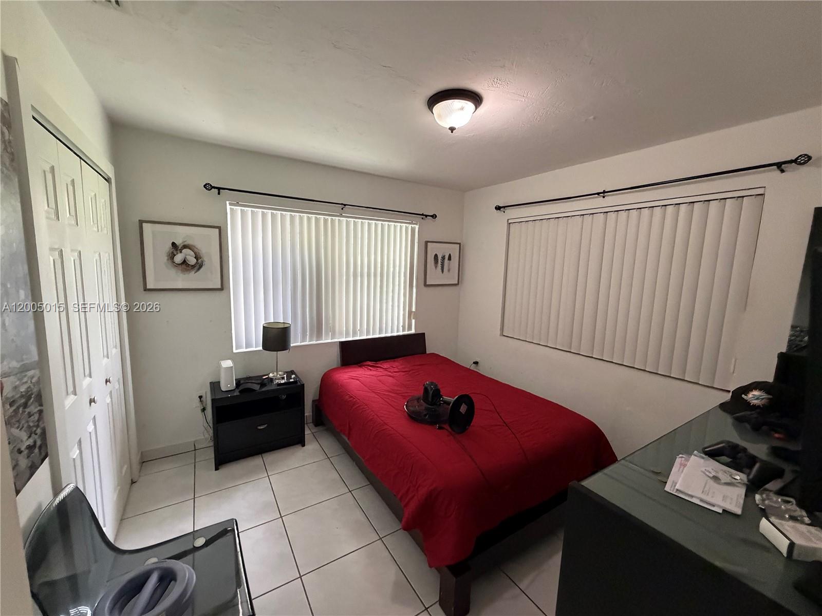 3361 Southwest 28th Street Miami, FL 33133 - Photo 15 of 17 a bedroom with a bed and a window