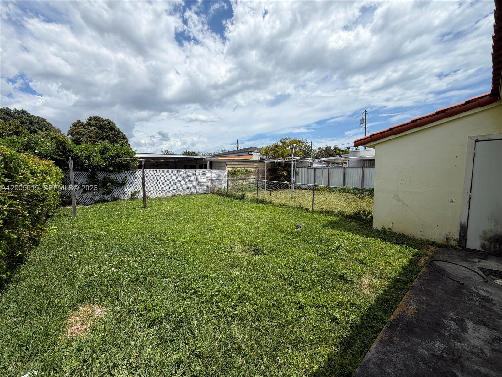 3361 Southwest 28th Street Miami, FL 33133 - Photo 17 of 17 a view of a house with a yard and sitting area