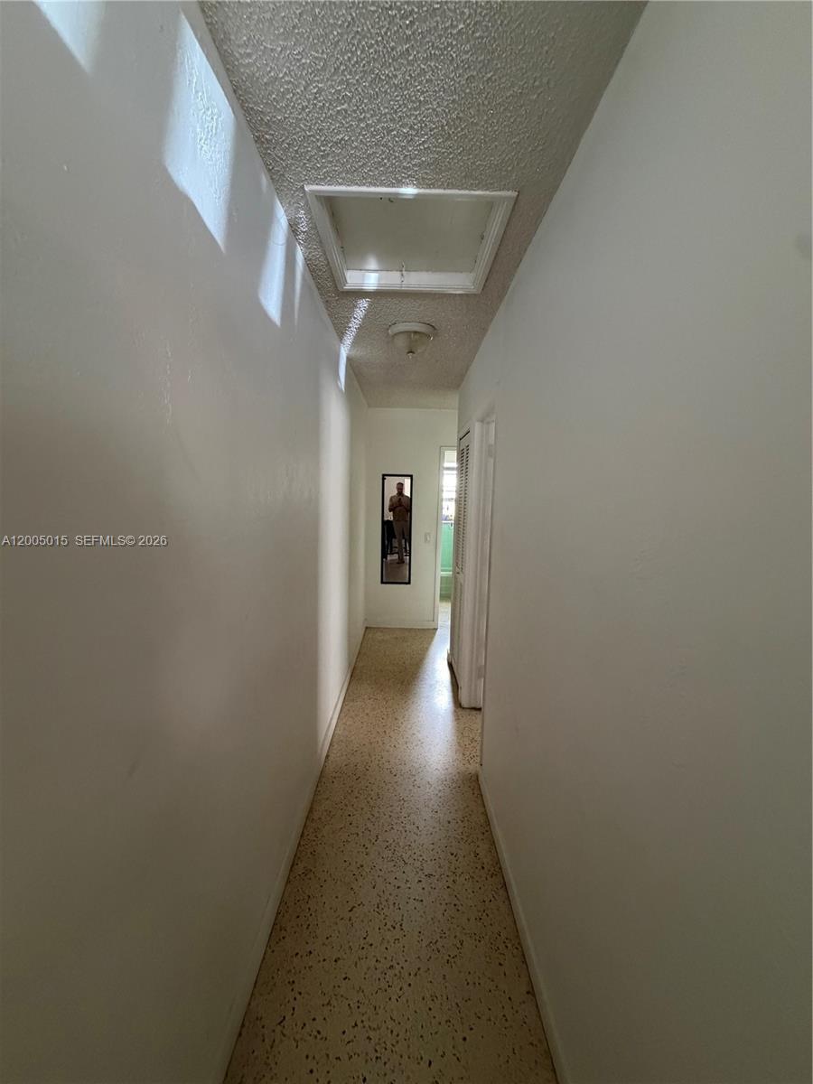 3361 Southwest 28th Street Miami, FL 33133 - Photo 4 of 17 a view of a hallway