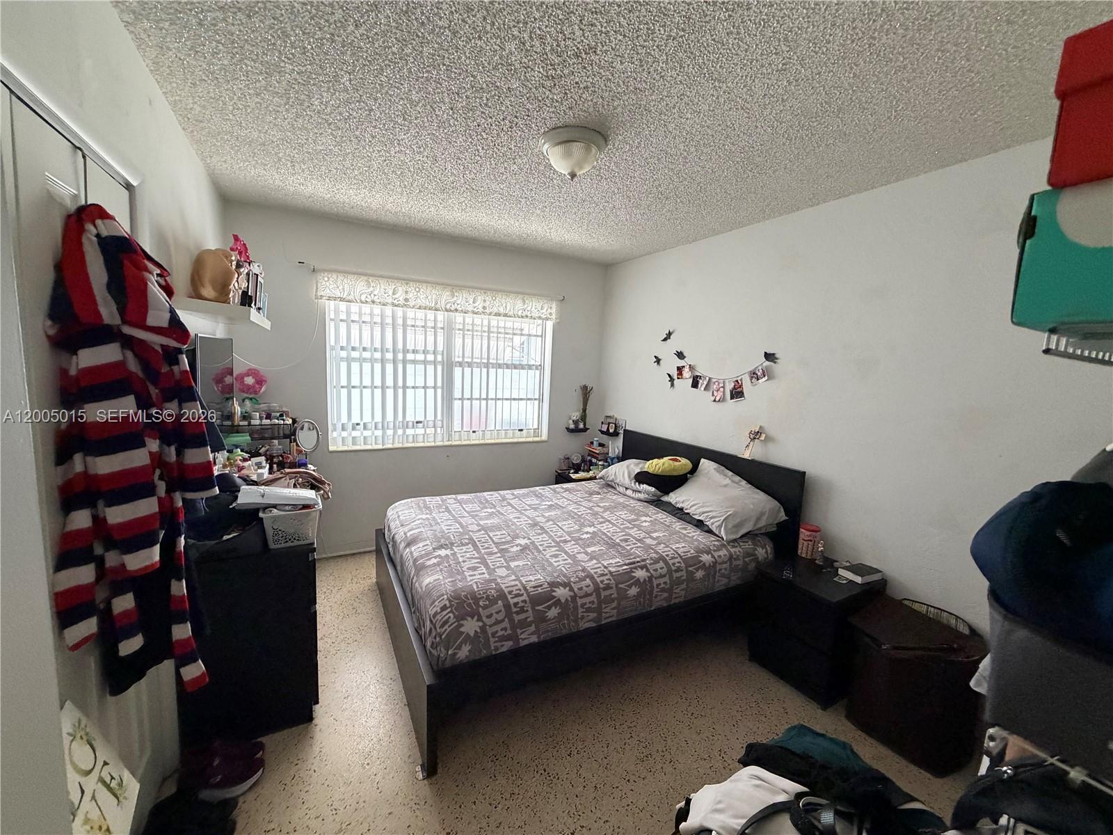 3361 Southwest 28th Street Miami, FL 33133 - Photo 5 of 17 a bedroom with a bed and a window