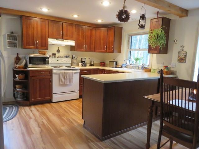 90 Little River Road Lebanon, ME 04027 - Photo 11 of 34 The kitchen has newer, laminate...